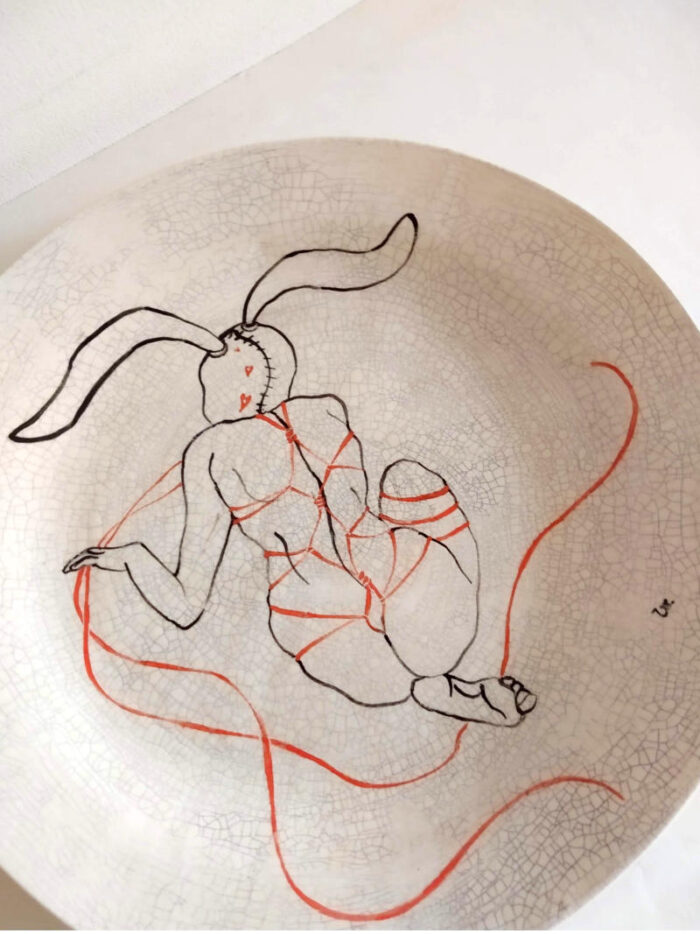 rabbit woman with strings plate by ursula aavasalu tigukass