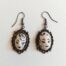 earrings with tiny faces I by ursula aavasalu tigukass
